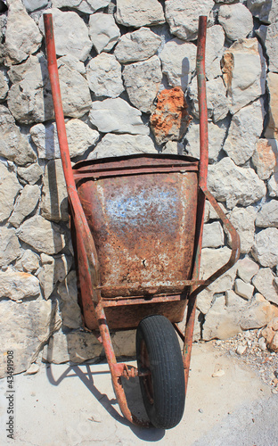 Photo: rusty old wheelbarrow rusty old wheelbarrow