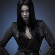 Fashion shoot of a young and sexy brunette Caucasian woman