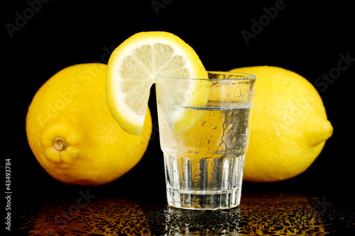 Photo: shot of tequila isolated on black background close-up shot of tequila isolated on black background close-up