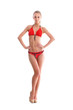 A young blond Caucasian woman posing in a red swimsuit