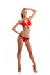 A young blond Caucasian woman posing in a red swimsuit