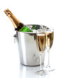 Champagne bottle in bucket with ice and glasses of champagne,