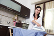 Photo: bright picture of lovely housewife with iron bright picture of lovely housewife with iron