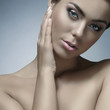 Portrait of a young naked woman in a beautiful makeup