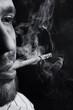 Face of a young man with a cigarette