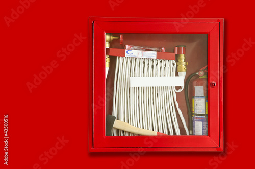 Photo: fire extinguisher and hose in the wall fire extinguisher and hose in the wall