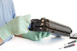 hands repairing toner cartridge