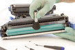 hands cleaning toner cartridge