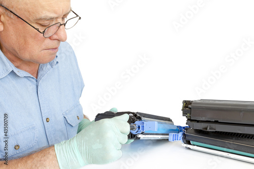 Photo: Man repairing toner cartridge Man repairing toner cartridge