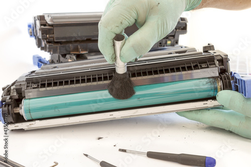Photo: hands cleaning toner cartridge hands cleaning toner cartridge