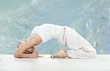 Photo: young woman practising yoga exercise young woman practising yoga exercise