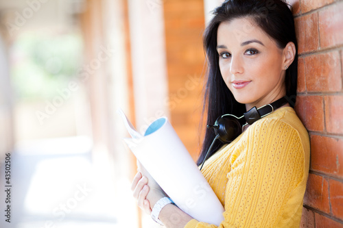 Photo: attractive young college girl reading book attractive young college girl reading book