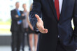 A business man with an open hand ready to seal a deal