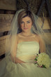 Foto: portrait of a beautiful young bride in the hayloft portrait of a beautiful young bride in the hayloft