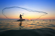 Photo: throwing fishing net during sunrise, Thailand throwing fishing net during sunrise, Thailand