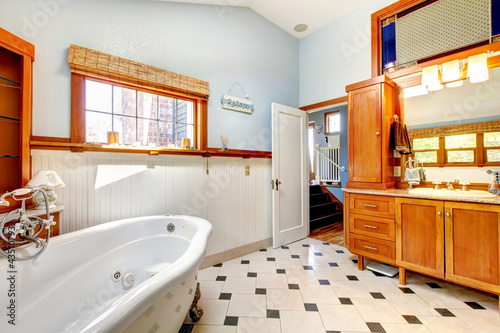 Photo: Large classic blue bathroom interior with tub and tiles. Large classic blue bathroom interior with tub and tiles.