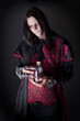 studio portrait of a man dressed as a vampire