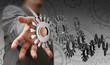 businessman hand shows people cogs