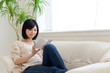a young asian woman reading book