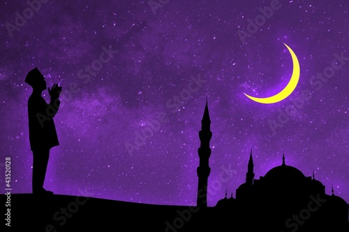 Photo: silhouette of a muslim male praying on the desert, islamic archi silhouette of a muslim male praying on the desert, islamic archi