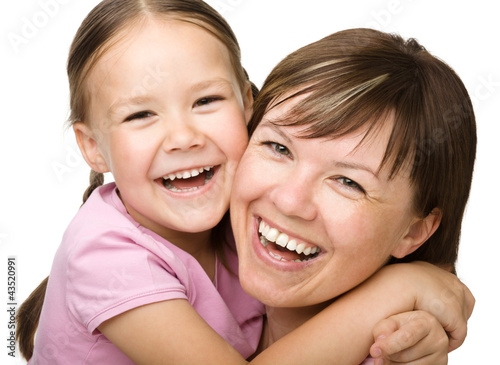 Photo: Portrait of a happy mother hugging her daughter Portrait of a happy mother hugging her daughter