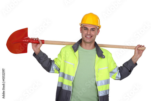 Photo: A construction worker with a shovel. A construction worker with a shovel.