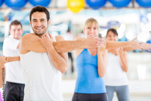 Photo: People warming up at the gym People warming up at the gym