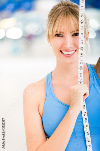 Photo: Woman loosing inches at the gym Woman loosing inches at the gym