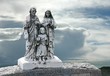 The holy family. Antique tombstone on a mountaintop