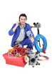 Plumber with a toolbox and cellphone