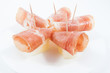 Photo: Jamon ham with melon plate isolated on white Jamon ham with melon plate isolated on white
