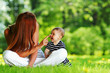 Photo: Mother and daughter on the green grass Mother and daughter on the green grass