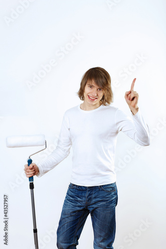 Photo: Man with paint brushes Man with paint brushes