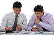 Businessmen with a calculator