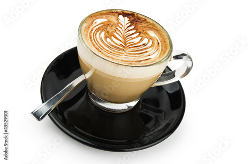 Foto: cup of cappuccino with artistic cream decoration cup of cappuccino with artistic cream decoration