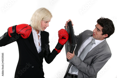 Photo: Businesspeople boxing. Businesspeople boxing.