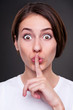 woman making silence sign