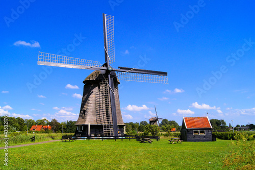 Photo: Traditional Dutch windmill under blue skies near Almaar Traditional Dutch windmill under blue skies near Almaar
