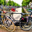 Bicycle along a canal in Amsterdam, the Netherlands
