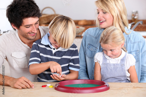 Photo: Parents playing with children Parents playing with children