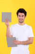 craftsman holding two bathroom tiles