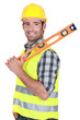 Happy worker resting spirit-level on shoulder