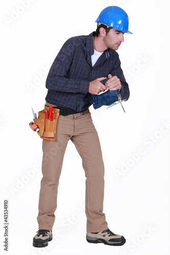 Foto: Tradesman staring at the floor Tradesman staring at the floor