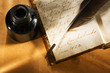 Old book with feather pen