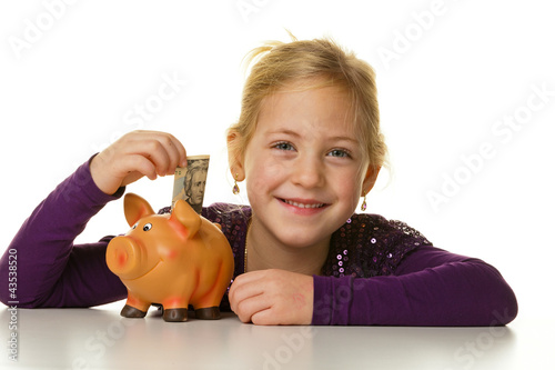 Photo: Kind mit Sparschwein. Dollar sparen Kind mit Sparschwein. Dollar sparen