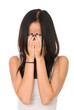 Girl in despair shuts face with hands