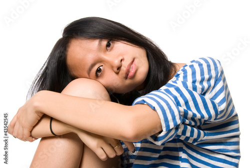 Photo: Portrait of girl put head on knees Portrait of girl put head on knees