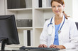 Female Woman Hospital Doctor Using Computer