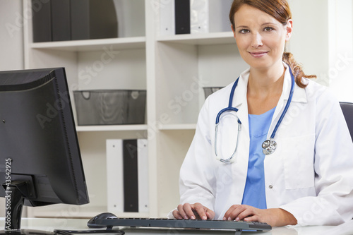 Photo: Female Woman Hospital Doctor Using Computer Female Woman Hospital Doctor Using Computer