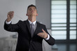 Businessman conducting his work and business with his baton